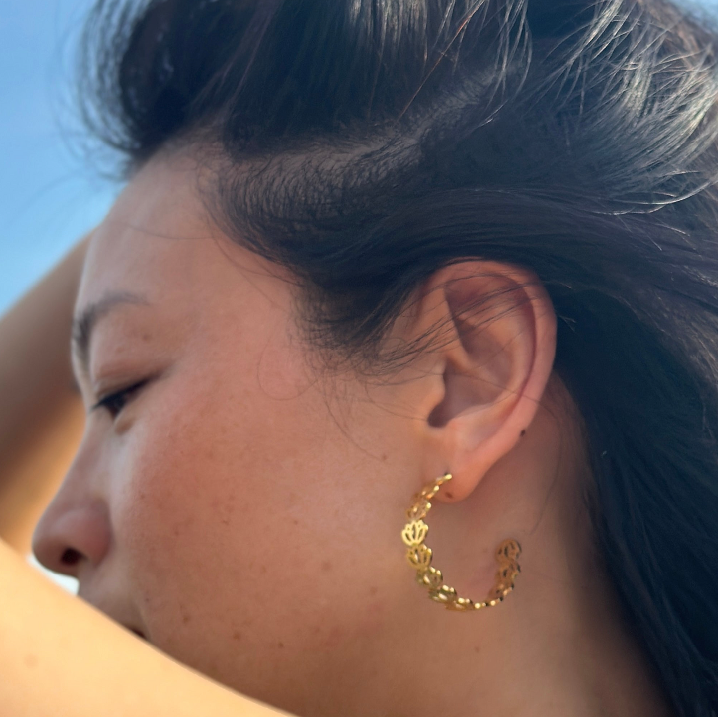 Side view of the Padma lotus gold adjustable hoop