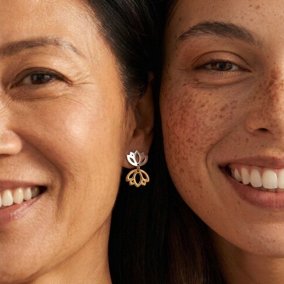 Two smiling friends, with Butterfly double-lotus studs worn on the left