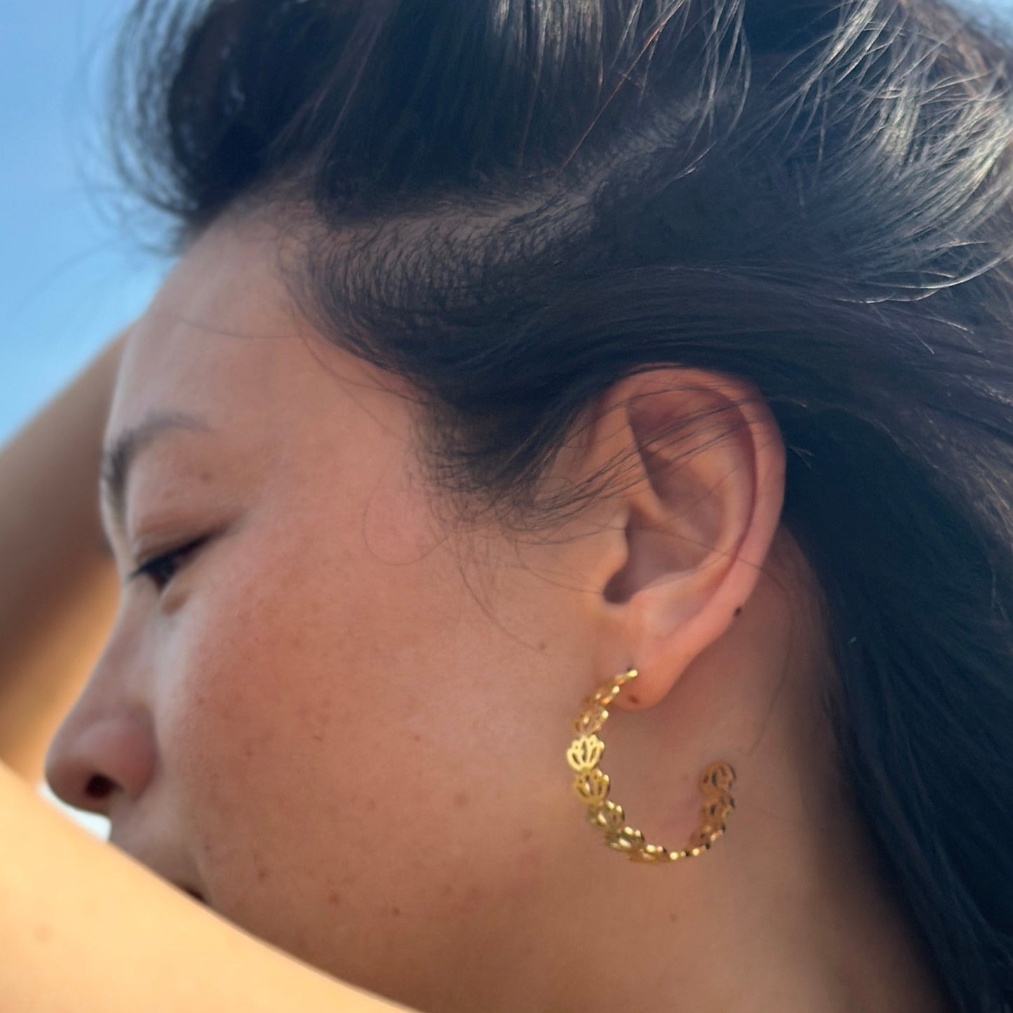 Side view of the Padma lotus gold adjustable hoop
